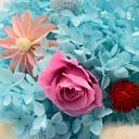 Blue dried gypsophila and bunny tail grass arranged in an ice cream cone preserved flower bouquet by ZESO Blooms™