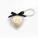 Heart Bloom Keychain by ZESO Blooms — preserved rose charm in heart-shaped acrylic case with pearl loop and satin ribbon.
