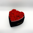 Open red heart-shaped preserved rose box displaying twelve real preserved roses by ZESO Blooms