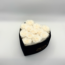 Open white heart-shaped preserved rose box showing twelve preserved roses by ZESO Blooms