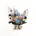 Midnight Black butterfly-embossed floral wrapping used in an elegant bouquet by ZESO Blooms — glossy semi-transparent OPP film for premium gifting.