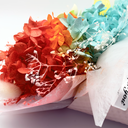 Close-up of bunny tail grass and dried florals in a pink ice cream cone preserved flower bouquet by ZESO Blooms™