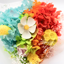 Detail of pink dried gypsophila and filler flowers arranged in an ice cream cone preserved flower bouquet by ZESO Blooms™