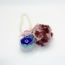 Preserved flower keychain with plush charm, featuring a real forever rose in a round plastic case by ZESO Blooms™