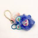 Preserved rose keychain with plush charm, real flower sealed in a round plastic container, gift-ready design from ZESO Blooms™