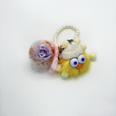 Preserved rose plush keychain designed as a small gift charm, real flower protected in a round plastic case by ZESO Blooms™
