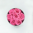 Top view of pink round preserved rose box with seven preserved roses from ZESO Blooms